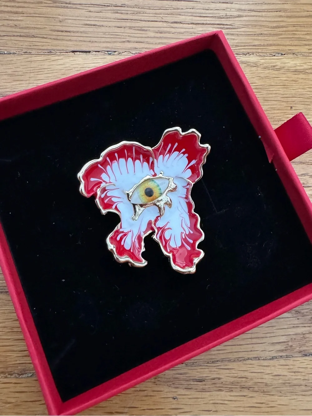 Uniqlo Red and White Enamel Eye Brooch with Gold Trim